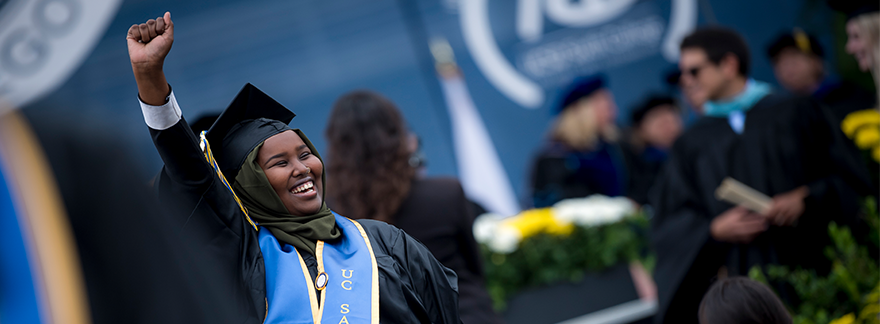 UC San Diego students celebrate in cap and gown at commencement (June 2017)
